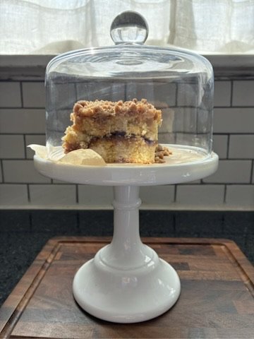 cinnamon streusel coffee cake in glass dome fir and maple